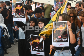 بالصور: مسيرة في عين المريسة في الذكرى الأولى لعملية البيجر