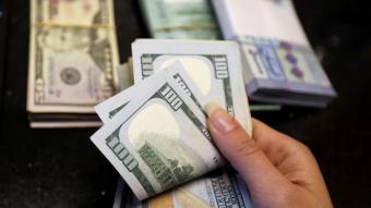 اليوم الأول لتطبيق تعميم الألف دولار: التزام جزئي بانتظار تحديث البرامج