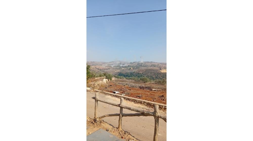 An Israeli drone drops explosive canisters on homes in Bani Hayyan